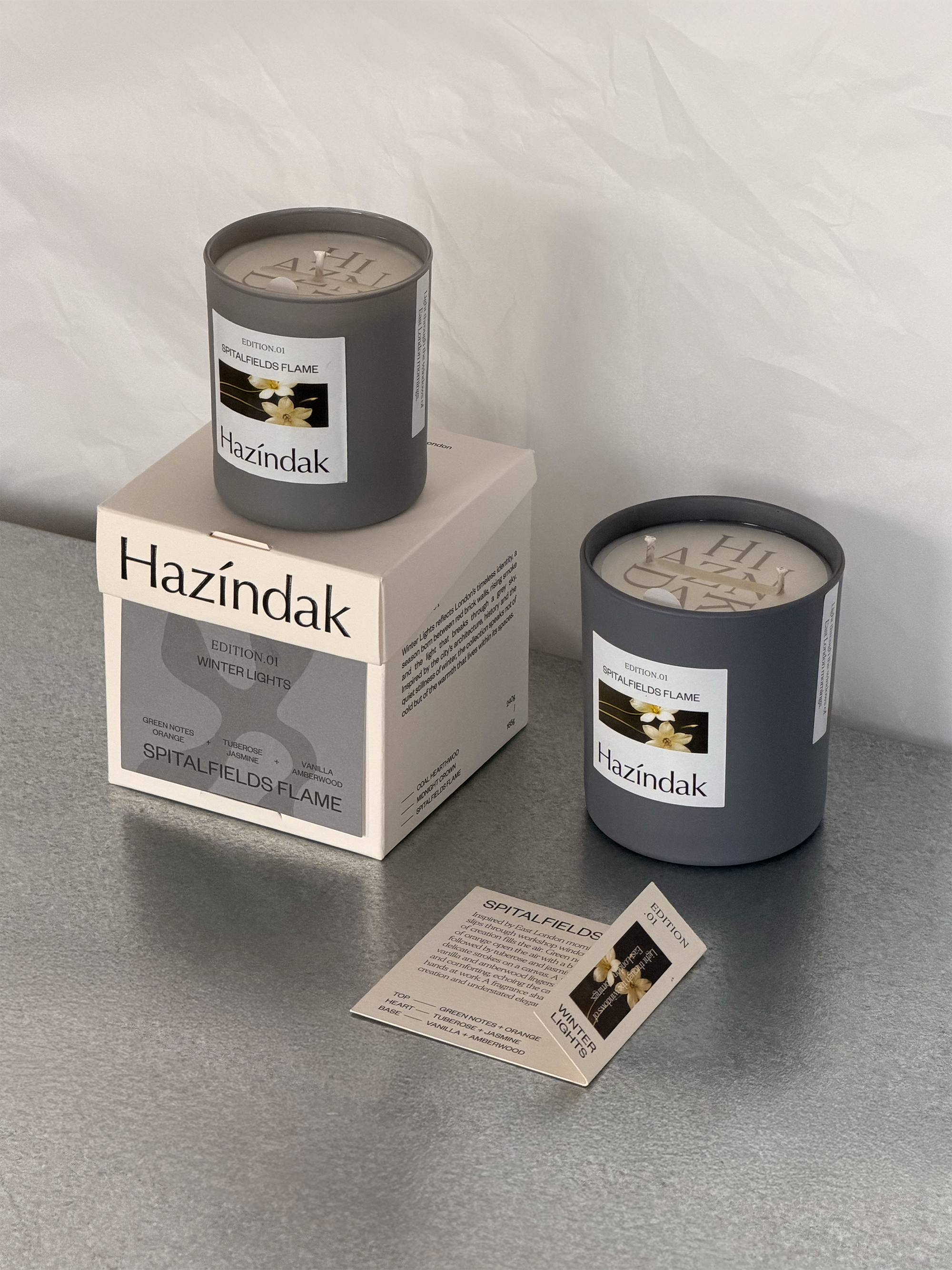 Hazindak Spitalfields Flame handmade scented candle in a minimalist glass jar, London studio craft.