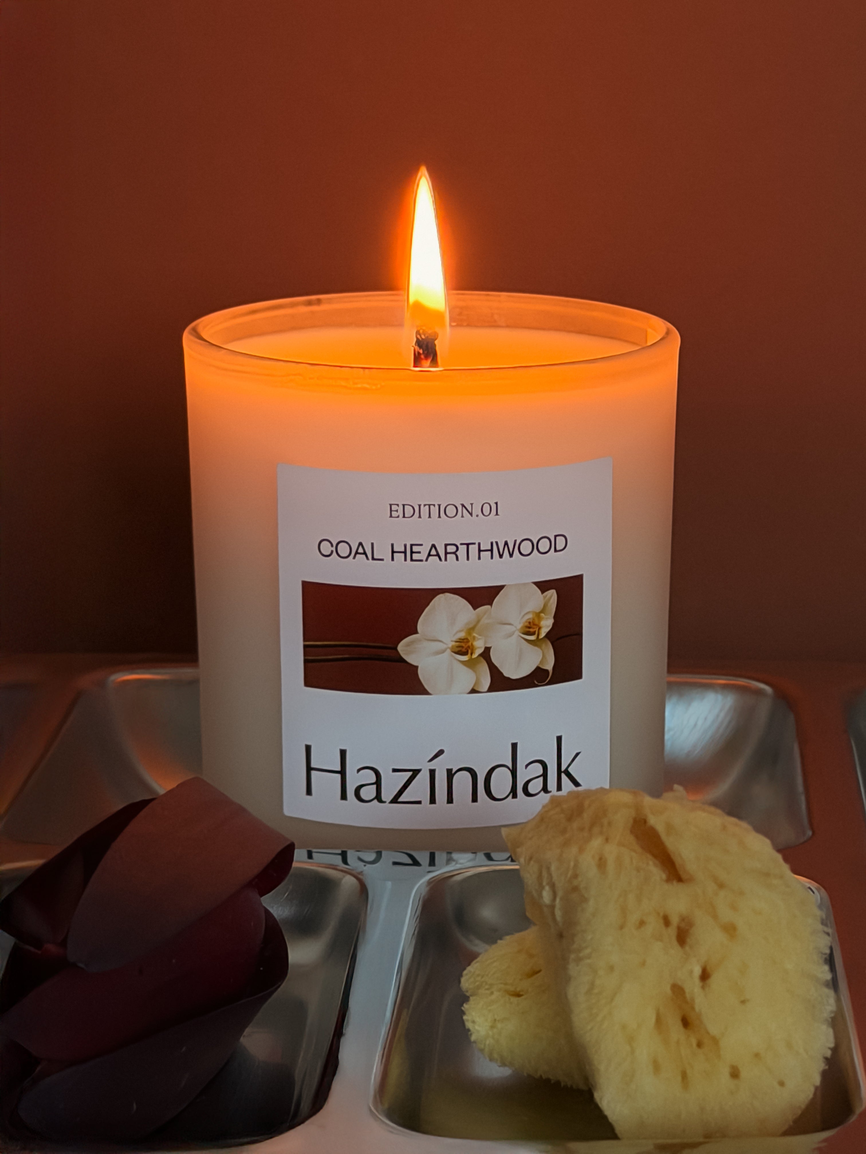 Detailed view of Hazindak Coal Hearthwood candle label, showcasing premium minimalist typography.