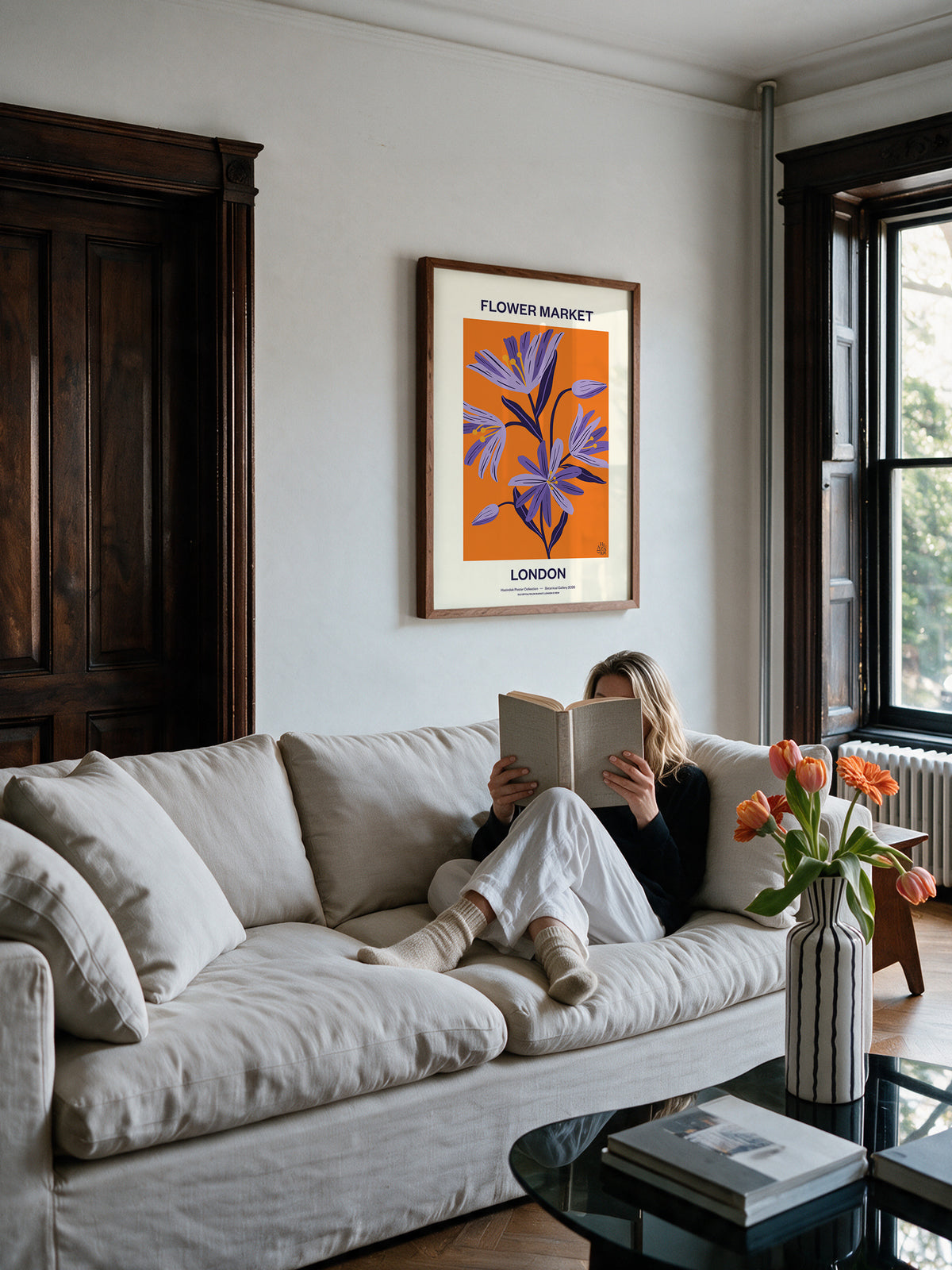 Flower Market London No.03 Violet botanical wall art styled above a sofa in a warm modern living room