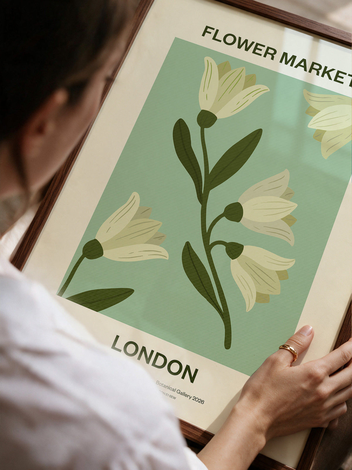 Flower Market London No.04 Sage canvas print held in a walnut frame with cream flowers and deep green stems