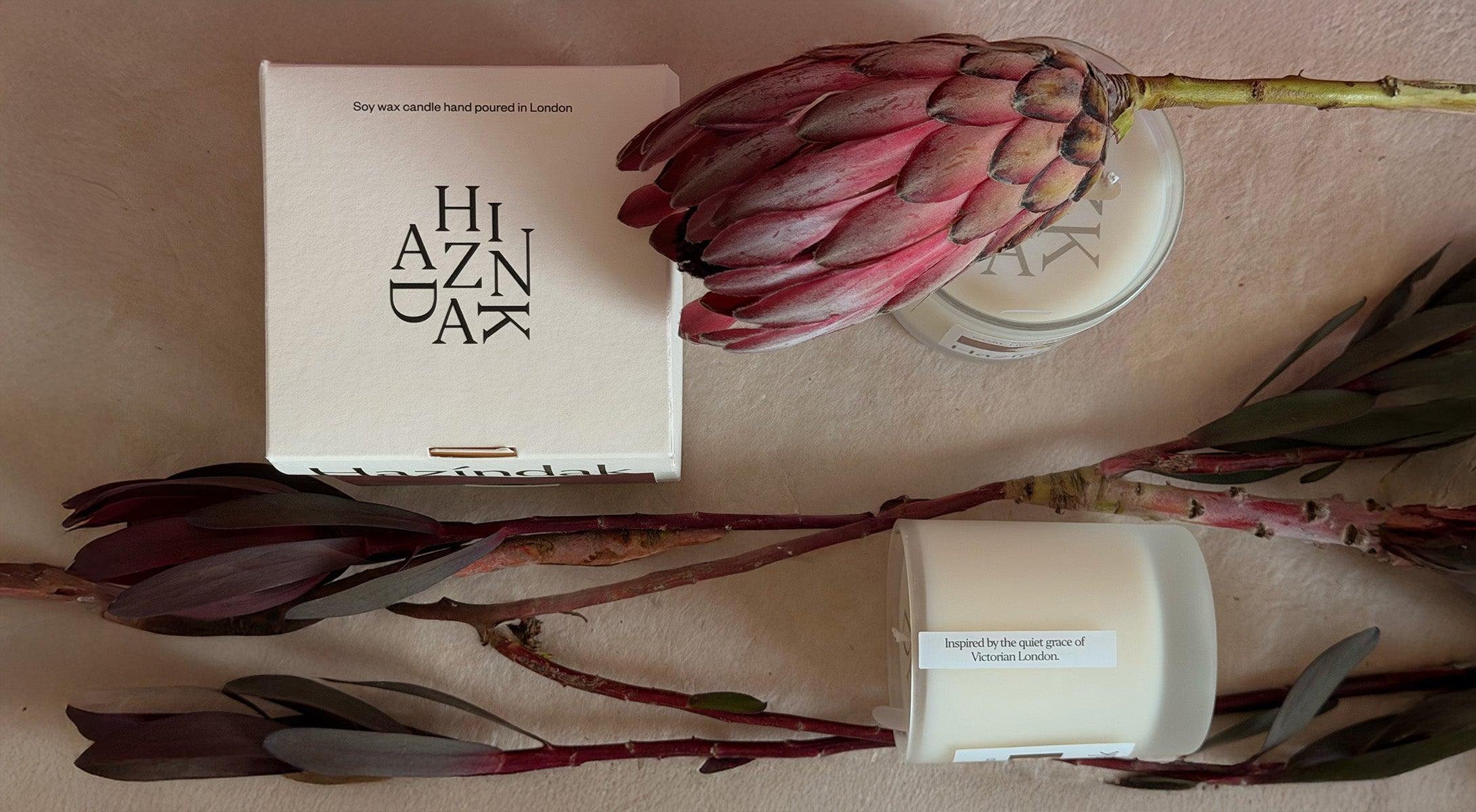 Curated collection of Hazindak scented candles and minimalist art posters, perfect for luxury wedding and housewarming gifts