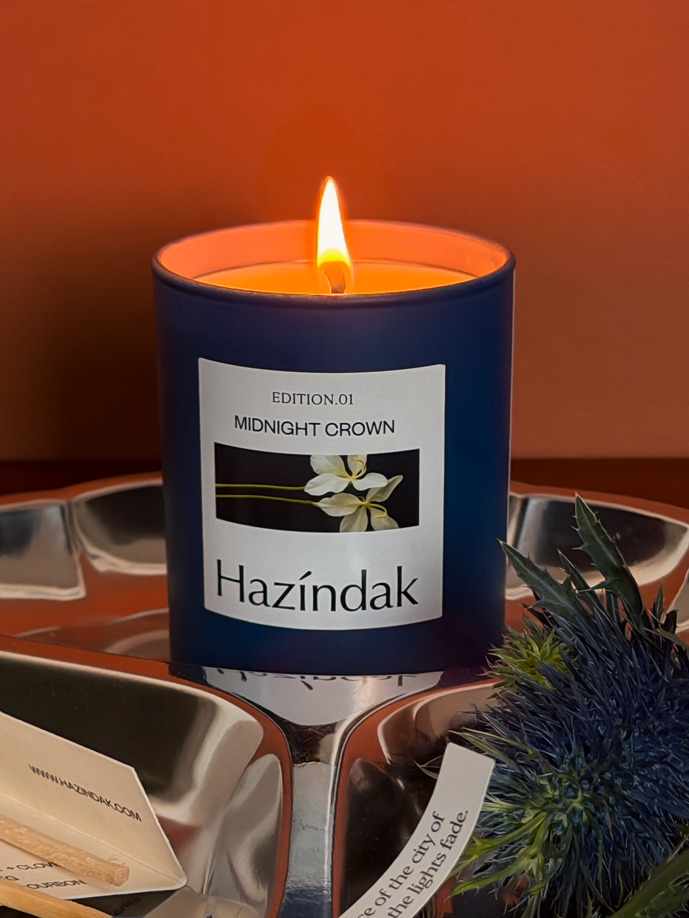 Close-up of the smooth soy wax and natural wick of a Hazindak Midnight Crown scented candle.