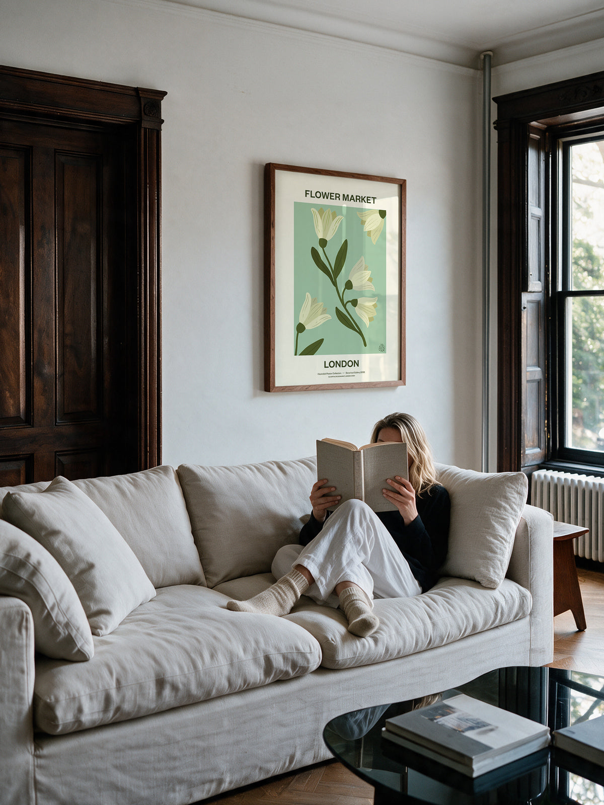 Flower Market London No.04 Sage floral wall art styled above a neutral sofa in a light-filled living room