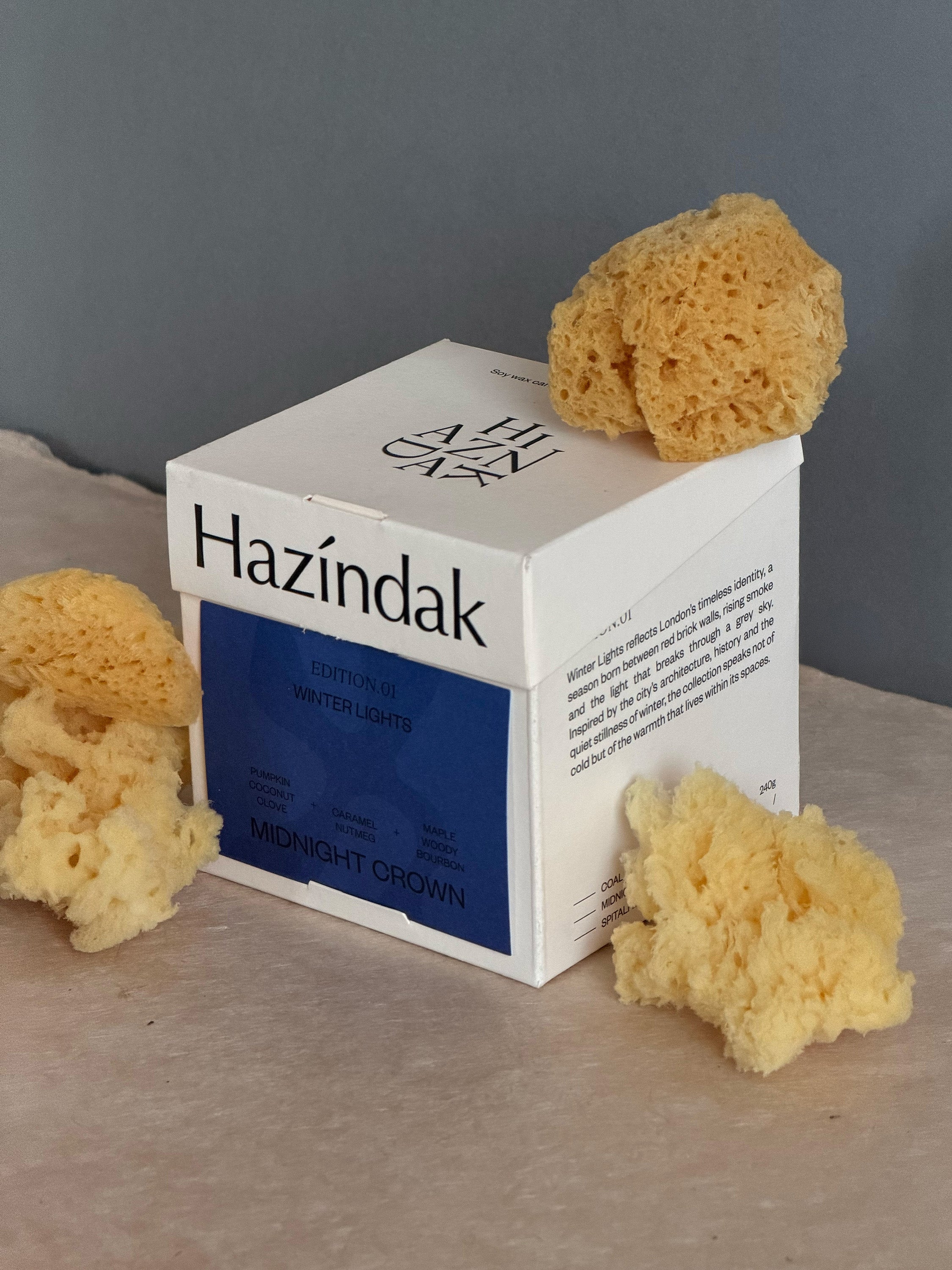 Elegant Midnight Crown candle styled in a dark, modern interior setting for a sophisticated vibe.